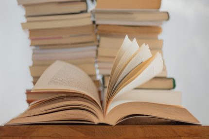 elisa-calvet-b-S3nUOqDmUvc-unsplash Stack of books on table